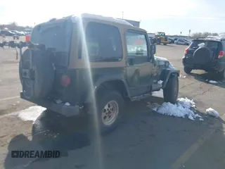 1998 Jeep Wrangler Sahara z VIN 1J4FY49S3WP744619, wystawiony jako IAAI lot #41107702 z przebiegiem 105 432 mil mil oraz . Historia ofert i sprzedaży dostępna na DreamBid. Obrazek 4.