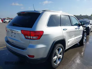 2013 Jeep Grand Cherokee Overland with VIN 1C4RJECG9DC545886, listed as a IAAI auction lot 41998913 with 166,077 mi miles. Bid and sale history available at carsss.com. Image 4.