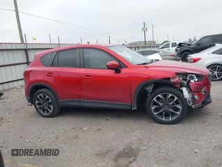 2016 Mazda CX-5 Grand Touring with VIN JM3KE2DY8G0871574, listed as a IAAI auction lot 41959686 with 95,416 mi miles and . Bid and sale history available at DreamBid. Image 13.