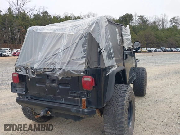2003 Jeep Wrangler X with VIN 1J4FA39S33P375741, listed as a IAAI auction lot 40858427 with Not provided miles and . Bid and sale history available at DreamBid. Image 4.
