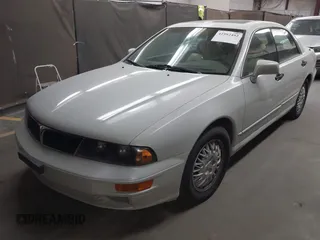 1999 Mitsubishi Diamante z VIN 6MMAP47P4XT003895, wystawiony jako IAAI lot #41992452 z przebiegiem 170 964 mil mil oraz . Historia ofert i sprzedaży dostępna na DreamBid. Obrazek 2.