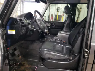 2005 Mercedes-Benz G with VIN WDCYR71E65X160243, listed as a Copart auction lot 48140075 with 164,457 mi miles and Salvage Title. Bid and sale history available at DreamBid. Image 7.