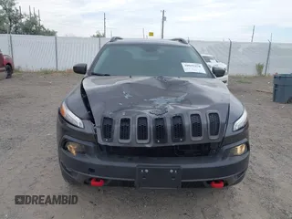2015 Jeep Cherokee Trailhawk with VIN 1C4PJMBSXFW654754, listed as a IAAI auction lot 39935278 with 128,076 mi miles and . Bid and sale history available at DreamBid. Image 6.