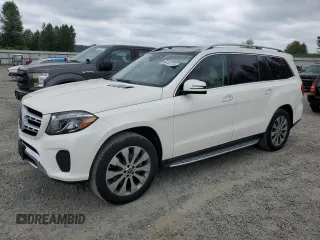 2018 Mercedes-Benz GLS 450 with VIN 4JGDF6EE8JB173550, listed as a Copart auction lot 63137774 with 61,974 mi miles and Salvage Title. Bid and sale history available at DreamBid. Image 1.