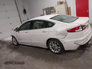 2019 Ford Fusion Hybrid SEL with VIN 3FA6P0MU8KR272811, listed as a IAAI auction lot 41705282 with 56,565 mi miles. Bid and sale history available at carsss.com. Image 14.