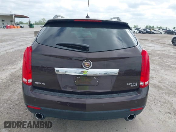 2015 Cadillac SRX Luxury Collection z VIN 3GYFNBE35FS597538, wystawiony jako IAAI lot #42056002 z przebiegiem 49 483 mil mil oraz . Historia ofert i sprzedaży dostępna na DreamBid. Obrazek 16.