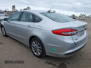 2017 Ford Fusion Energi SE with VIN 3FA6P0PU9HR354096, listed as a IAAI auction lot 42064703 with 69,601 mi miles. Bid and sale history available at carsss.com. Image 3.