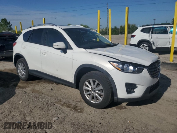 2016 Mazda CX-5 Touring z VIN JM3KE2CYXG0683673, wystawiony jako Copart lot #56724025 z przebiegiem 107 293 mil mil oraz Szkoda całkowita • Salvage title. Historia ofert i sprzedaży dostępna na DreamBid. Obrazek 4.