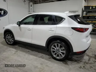 2021 Mazda CX-5 Grand Touring with VIN JM3KFBDM4M1344602, listed as a Copart auction lot 82793724 with 69,322 mi miles and Salvage Title. Bid and sale history available at carsss.com. Image 2.