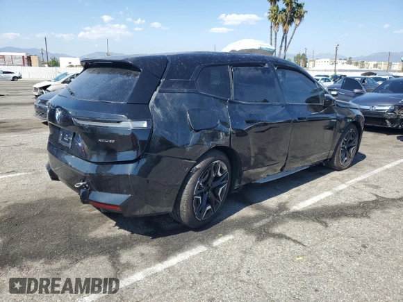 2025 BMW iX xDrive50 z VIN WB523CF02SCS06555, wystawiony jako Copart lot #55291115 z przebiegiem Nie podano mil oraz Szkoda całkowita • Salvage title. Historia ofert i sprzedaży dostępna na DreamBid. Obrazek 3.