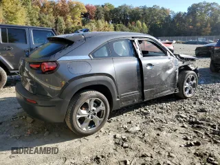 2023 Mazda MX-30 Premium Plus Package with VIN JM1DRADBXP0200211, listed as a Copart auction lot 77109834 with 10,778 mi miles and Salvage Title. Bid and sale history available at carsss.com. Image 3.