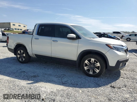 2019 Honda Ridgeline RTL-E with VIN 5FPYK3F72KB021673, listed as a Copart auction lot 50599005 with 65,469 mi miles and Salvage title. Bid and sale history available at DreamBid. Image 4.