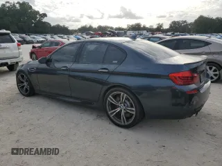 2016 BMW M5 z VIN WBSFV9C51GD595430, wystawiony jako Copart lot #79675834 z przebiegiem 82 351 mil mil oraz Szkoda całkowita • Salvage title. Historia ofert i sprzedaży dostępna na DreamBid. Obrazek 2.