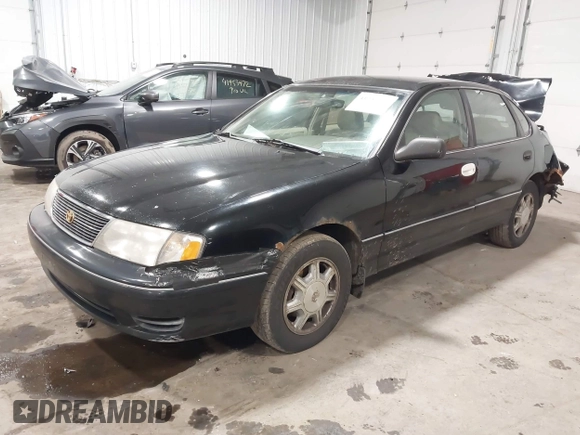 1998 Toyota Avalon XL with VIN 4T1BF18B5WU229340, listed as a IAAI auction lot 41957632 with 212,657 mi miles and . Bid and sale history available at DreamBid. Image 2.