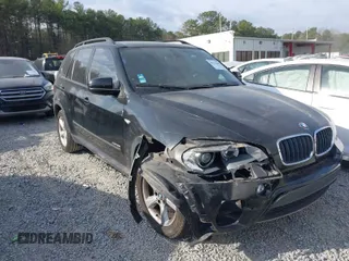 2011 BMW X5 35i with VIN 5UXZV4C58BL406373, listed as a IAAI auction lot 41715817 with 101,900 mi miles. Bid and sale history available at carsss.com. Image 1.