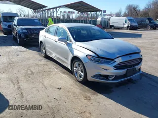 2018 Ford Fusion Hybrid SE with VIN 3FA6P0LU1JR272522, listed as a IAAI auction lot 41796432 with 123,471 mi miles. Bid and sale history available at carsss.com. Image 1.