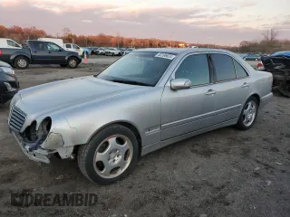 2000 Mercedes-Benz E-Class with VIN WDBJF70J7YB049473, listed as a Copart auction lot 82396624 with 197,515 mi miles and Salvage Title. Bid and sale history available at carsss.com. Image 1.