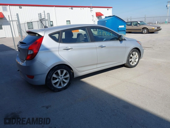 2012 Hyundai Accent SE with VIN KMHCU5AE0CU021092, listed as a IAAI auction lot 41789027 with 137,557 mi miles. Bid and sale history available at carsss.com. Image 4.