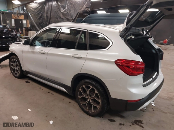2021 BMW X1 xDrive28i with VIN WBXJG9C0XM5T76975, listed as a IAAI auction lot 41310115 with 26,869 mi miles. Bid and sale history available at carsss.com. Image 3.
