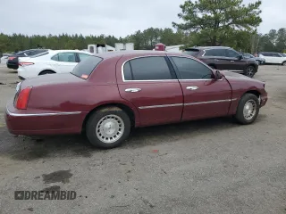 1999 Lincoln Town Car Executive z VIN 1LNHM81W5XY655075, wystawiony jako Copart lot #43263935 z przebiegiem Nie podano mil oraz Szkoda całkowita • Salvage title. Historia ofert i sprzedaży dostępna na DreamBid. Obrazek 3.