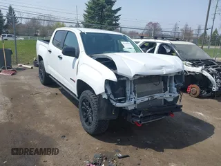 2021 GMC Canyon 4WD AT4 z VIN 1GTG6FENXM1291689, wystawiony jako IAAI lot #42038884 z przebiegiem 54 884 mil mil oraz . Historia ofert i sprzedaży dostępna na DreamBid. Obrazek 1.