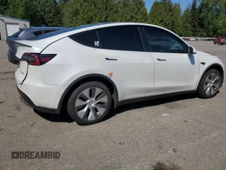 2020 Tesla Model Y Long Range with VIN 5YJYGDEF9LF023060, listed as a Copart auction lot 55462395 with 58,211 mi miles and Salvage Title. Bid and sale history available at DreamBid. Image 3.