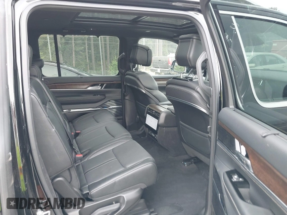 2023 Jeep Grand Wagoneer with VIN 1C4SJVEJ2PS573498, listed as a IAAI auction lot 42684957 with 7,334 mi miles and . Bid and sale history available at DreamBid. Image 8.