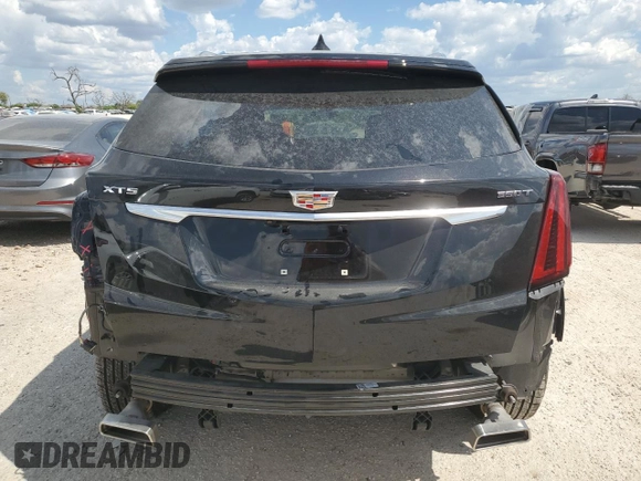 2024 Cadillac XT5 FWD Luxury with VIN 1GYKNAR42RZ731988, listed as a Copart auction lot 72777544 with 5,965 mi miles and Salvage title. Bid and sale history available at DreamBid. Image 6.