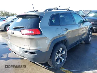 2017 Jeep Cherokee Trailhawk L Plus with VIN 1C4PJMBB6HW654172, listed as a IAAI auction lot 41851236 with 104,263 mi miles. Bid and sale history available at carsss.com. Image 4.