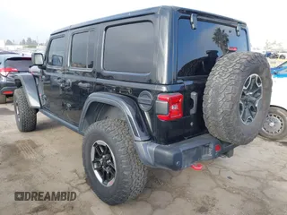 2020 Jeep Wrangler Unlimited Rubicon with VIN 1C4HJXFG1LW141335, listed as a IAAI auction lot 42724973 with 59,843 mi miles and . Bid and sale history available at DreamBid. Image 3.