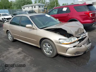 2002 Honda Accord EX z VIN 1HGCG16502A044399, wystawiony jako IAAI lot #42289422 z przebiegiem 154 889 mil mil oraz . Historia ofert i sprzedaży dostępna na DreamBid. Obrazek 1.