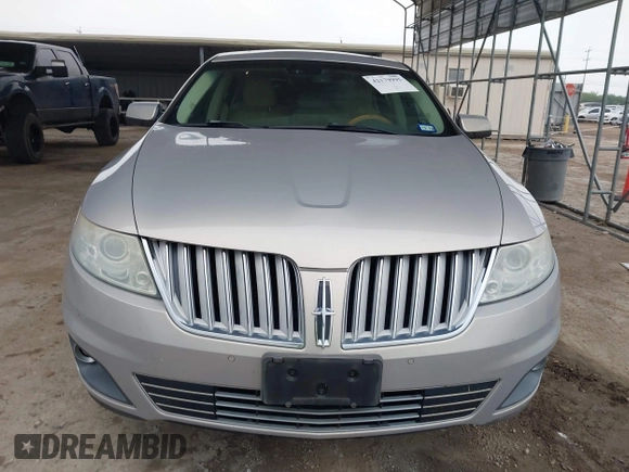 2009 Lincoln MKS z VIN 1LNHM93R39G634750, wystawiony jako IAAI lot #42179995 z przebiegiem 166 151 mil mil oraz . Historia ofert i sprzedaży dostępna na DreamBid. Obrazek 13.