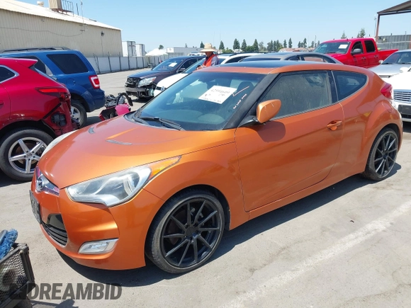 2012 Hyundai Veloster w/Black Int z VIN KMHTC6AD4CU049722, wystawiony jako IAAI lot #42594609 z przebiegiem 72 324 mil mil oraz . Historia ofert i sprzedaży dostępna na DreamBid. Obrazek 2.