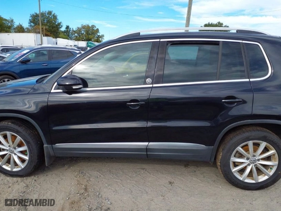 2017 Volkswagen Tiguan Wolfsburg Edition with VIN WVGSV7AX8HK003674, listed as a IAAI auction lot 40476672 with 67,930 mi miles. Bid and sale history available at carsss.com. Image 14.