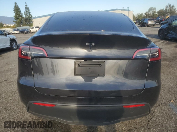 2024 Tesla Model Y with VIN 7SAYGDED7RF056973, listed as a Copart auction lot 87139214 with 15,391 mi miles and Salvage Title. Bid and sale history available at DreamBid. Image 6.