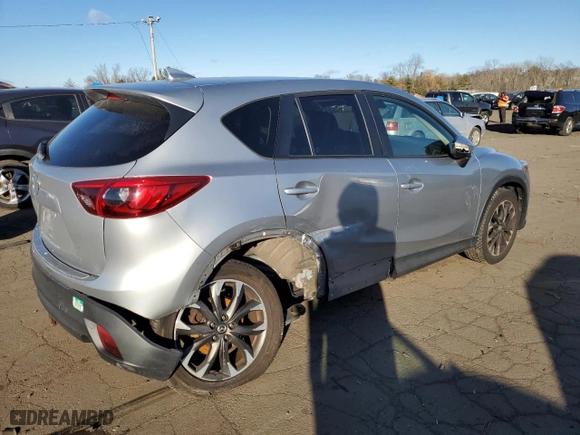 2016 Mazda CX-5 Grand Touring with VIN JM3KE4DYXG0713698, listed as a Copart auction lot 87176794 with 114,435 mi miles and Salvage Title. Bid and sale history available at carsss.com. Image 3.