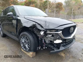 2020 Mazda CX-5 Touring with VIN JM3KFACM9L0770933, listed as a IAAI auction lot 41921464 with 75,997 mi miles. Bid and sale history available at carsss.com. Image 6.