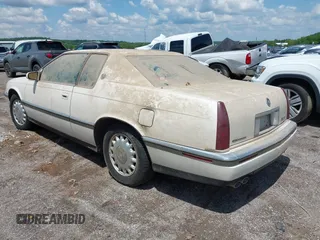 1994 Cadillac Eldorado ESC z VIN 1G6EL12Y4RU604343, wystawiony jako IAAI lot #42221885 z przebiegiem Nie podano mil oraz . Historia ofert i sprzedaży dostępna na DreamBid. Obrazek 3.