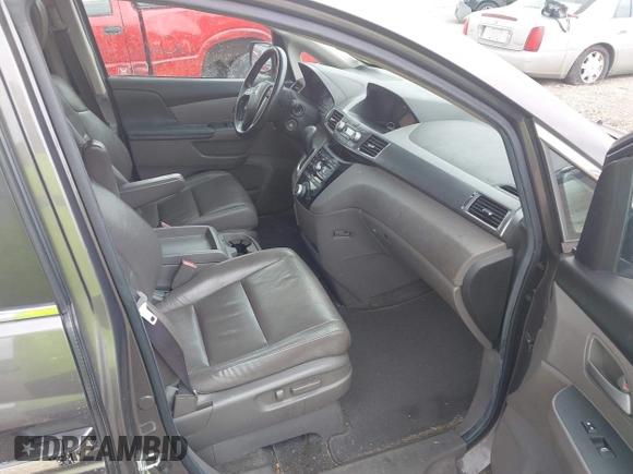 2012 Honda Odyssey EX-L with VIN 5FNRL5H60CB054277, listed as a IAAI auction lot 42459861 with 205,722 mi miles and . Bid and sale history available at DreamBid. Image 5.