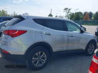 2016 Hyundai Santa Fe z VIN 5XYZTDLB0GG338313, wystawiony jako IAAI lot #42103866 z przebiegiem 111 555 mil mil oraz . Historia ofert i sprzedaży dostępna na DreamBid. Obrazek 13.
