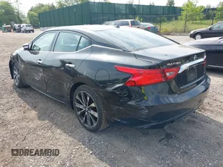 2016 Nissan Maxima Platinum z VIN 1N4AA6AP8GC901079, wystawiony jako IAAI lot #42423396 z przebiegiem 100 750 mil mil oraz . Historia ofert i sprzedaży dostępna na DreamBid. Obrazek 3.