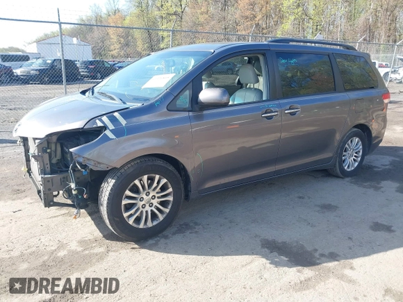 2014 Toyota Sienna XLE with VIN 5TDYK3DC5ES475750, listed as a IAAI auction lot 41976805 with 221,804 mi miles. Bid and sale history available at carsss.com. Image 17.