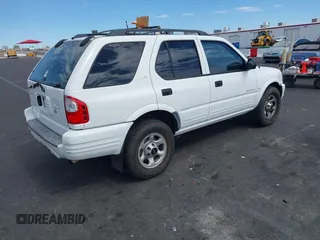 2001 Isuzu Rodeo S z VIN 4S2CK58W614329085, wystawiony jako IAAI lot #42303013 z przebiegiem 171 933 mil mil oraz . Historia ofert i sprzedaży dostępna na DreamBid. Obrazek 4.