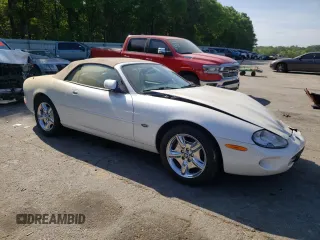 1999 Jaguar XK with VIN SAJGX2043XC040866, listed as a Copart auction lot 53712555 with 65,349 mi miles and Clean Title. Bid and sale history available at DreamBid. Image 4.