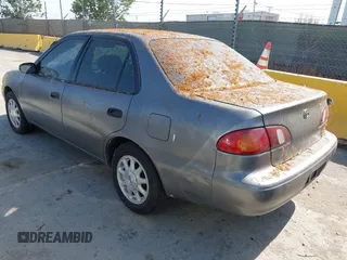 1999 Toyota Corolla VE z VIN 1NXBR12E5XZ237045, wystawiony jako IAAI lot #42413586 z przebiegiem Nie podano mil oraz . Historia ofert i sprzedaży dostępna na DreamBid. Obrazek 3.