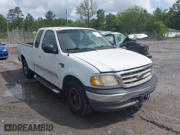 2003 Ford F-150 XL with VIN 1FTRX17L93NB61902, listed as a IAAI auction lot 42096982 with 318,850 mi miles. Bid and sale history available at carsss.com. Image 1.