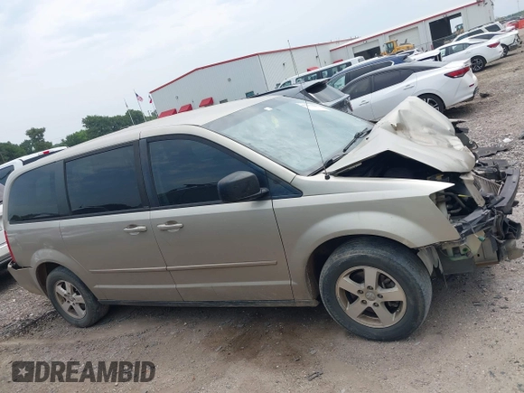 2009 Dodge Grand Caravan SE z VIN 1D8HN44E99B509833, wystawiony jako IAAI lot #42277393 z przebiegiem Nie podano mil oraz . Historia ofert i sprzedaży dostępna na DreamBid. Obrazek 14.