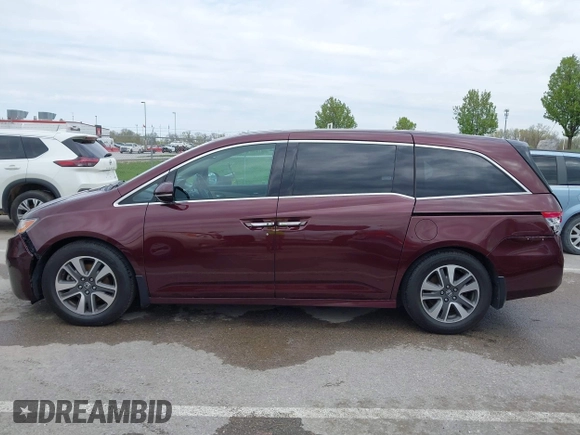 2014 Honda Odyssey Touring with VIN 5FNRL5H9XEB073156, listed as a IAAI auction lot 41990714 with 166,129 mi miles and . Bid and sale history available at DreamBid. Image 14.