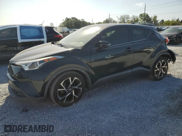 2019 Toyota C-HR XLE z VIN JTNKHMBX9K1016158, wystawiony jako Copart lot #54121995 z przebiegiem 119 716 mil mil oraz Szkoda całkowita • Salvage title. Historia ofert i sprzedaży dostępna na DreamBid. Obrazek 1.