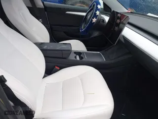 2021 Tesla Model 3 Performance with VIN 5YJ3E1EC3MF995632, listed as a IAAI auction lot 41548478 with 43,585 mi miles. Bid and sale history available at carsss.com. Image 5.